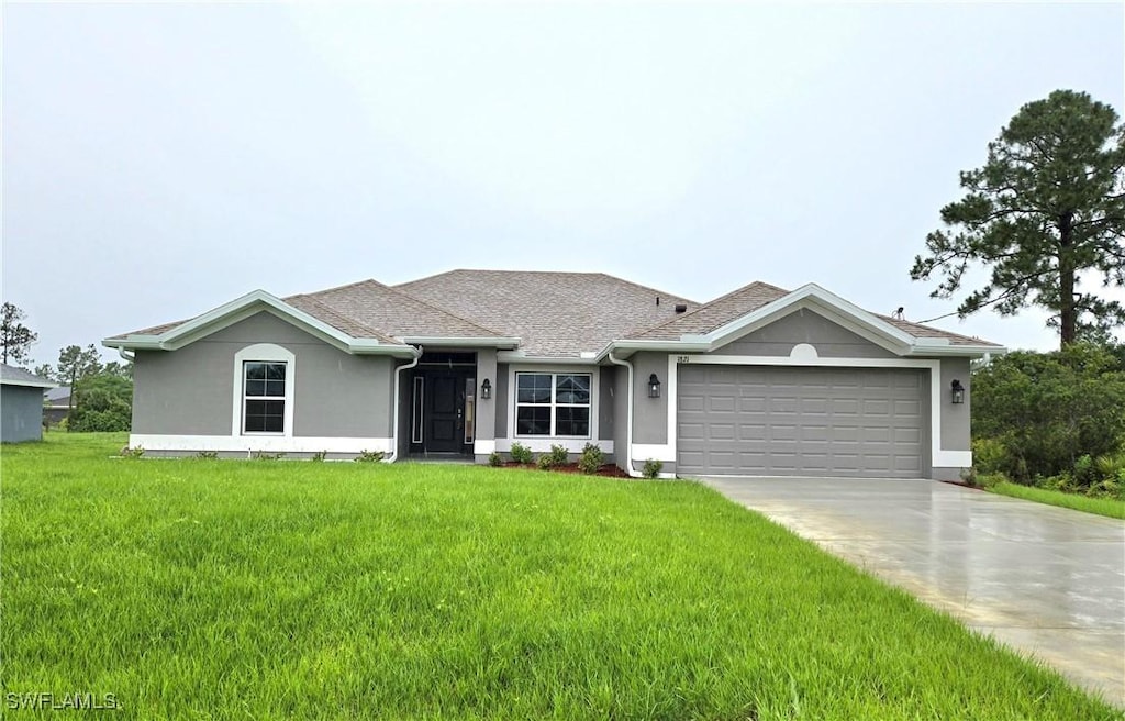 1821 Lodge St, Lehigh Acres, FL 33972 - ranch-style home featuring a garage, driveway, a front yard, and stucco siding