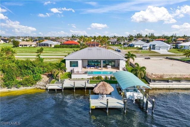 view of dock featuring a patio and a water view