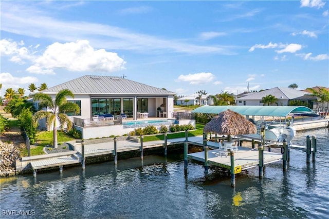 dock area with a water view and a patio area