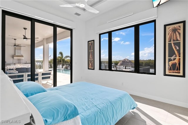 bedroom featuring ceiling fan, access to exterior, and light tile patterned floors