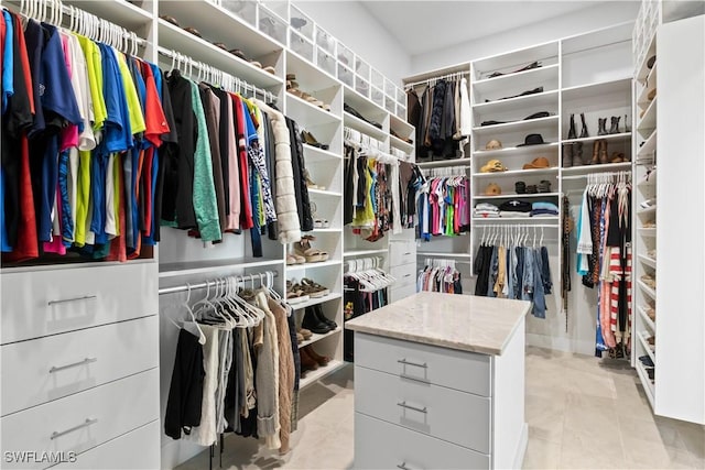 walk in closet featuring light tile patterned floors