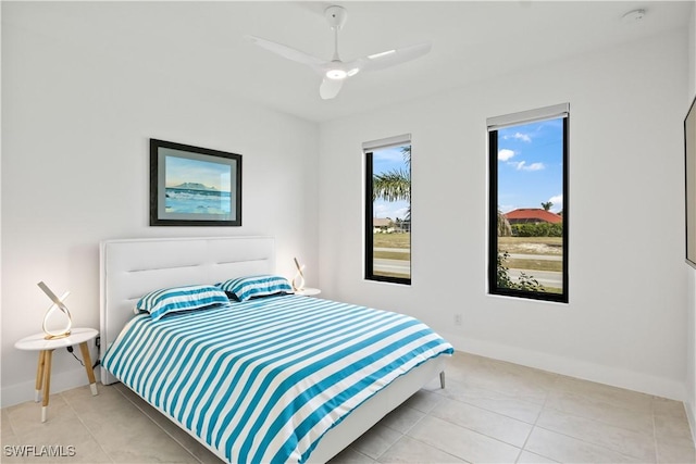 bedroom featuring light tile patterned flooring and ceiling fan