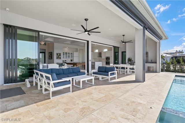 view of patio featuring ceiling fan, an outdoor living space, and a fenced in pool