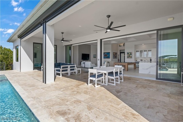 view of patio with outdoor lounge area and ceiling fan