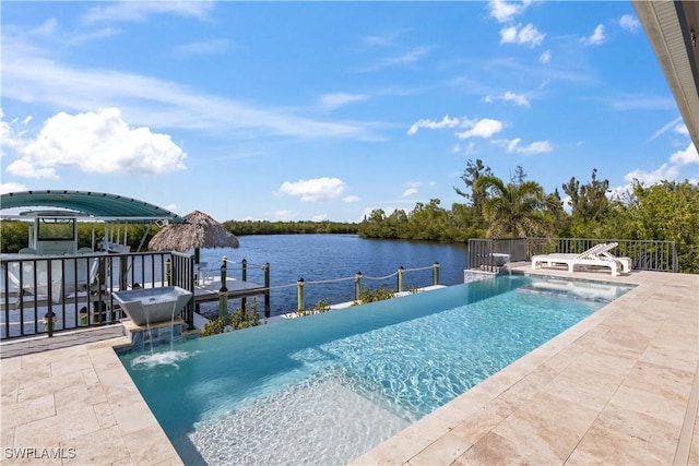 view of pool with a water view, pool water feature, and a patio area