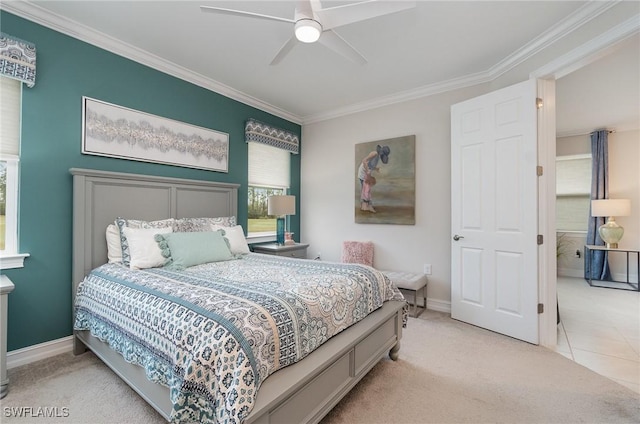 carpeted bedroom featuring ornamental molding and ceiling fan