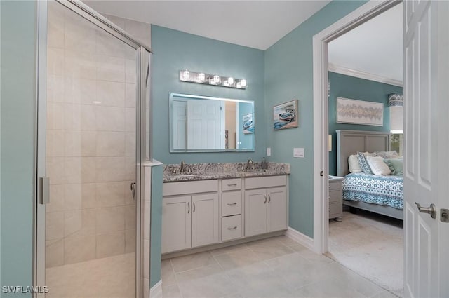 bathroom featuring vanity, an enclosed shower, and tile patterned floors