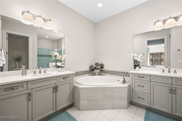 bathroom featuring plus walk in shower, tile patterned floors, and vanity