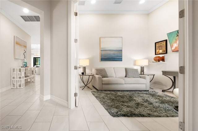 living room featuring light tile patterned floors and ornamental molding