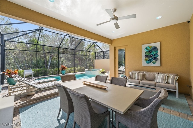 view of patio with glass enclosure, outdoor lounge area, and a swimming pool with hot tub