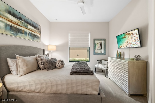 bedroom featuring ceiling fan and carpet