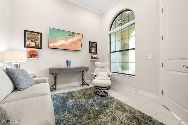 sitting room featuring light tile patterned floors and crown molding