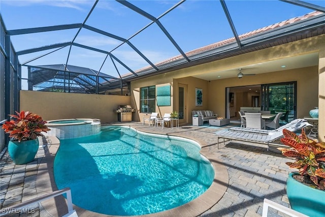 view of swimming pool featuring a lanai, grilling area, an outdoor hangout area, an in ground hot tub, and a patio