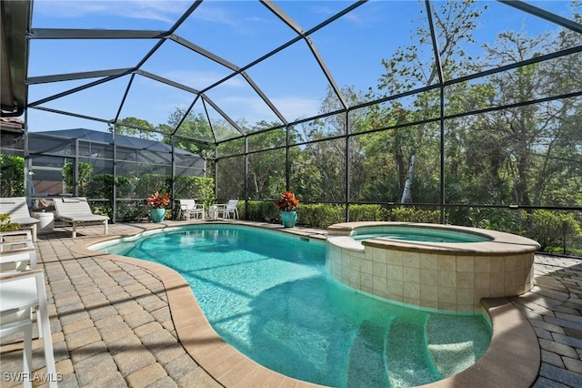 view of pool featuring glass enclosure, an in ground hot tub, and a patio