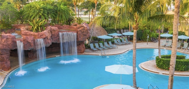 view of pool with pool water feature