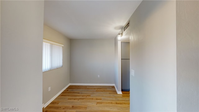 unfurnished room featuring light wood-type flooring