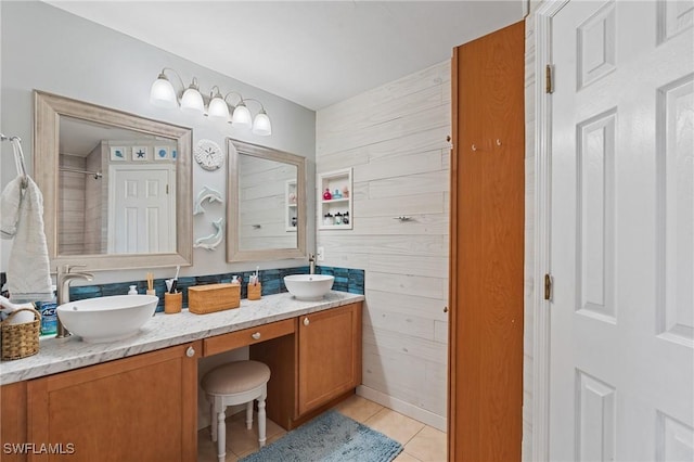 bathroom featuring tile patterned flooring and vanity