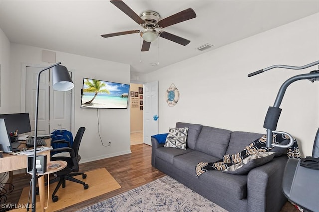 office area with ceiling fan and wood-type flooring