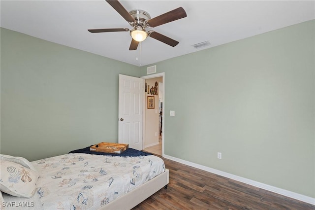 bedroom with ceiling fan and dark hardwood / wood-style flooring