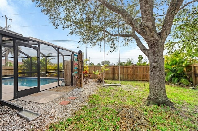 view of yard featuring a lanai and a fenced in pool