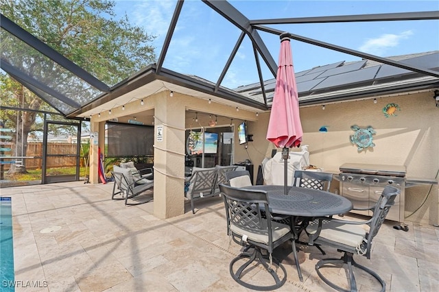 view of patio / terrace featuring glass enclosure