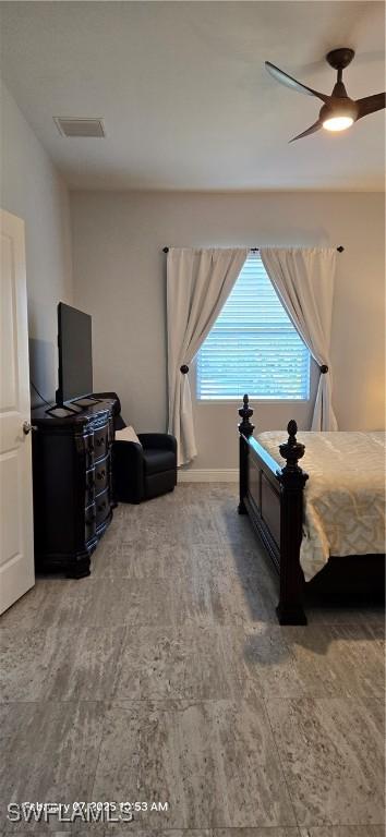 bedroom with wood-type flooring and ceiling fan