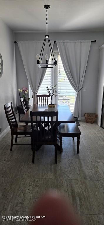 dining area featuring a chandelier