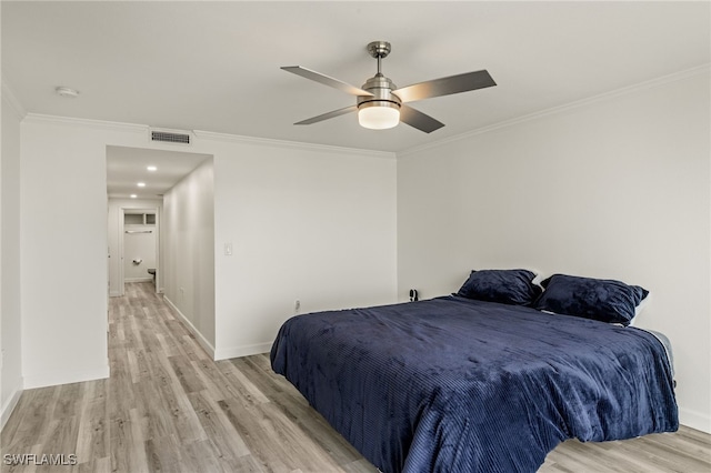 bedroom featuring crown molding, ceiling fan, and light wood-type flooring