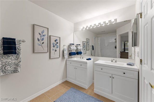 bathroom with tile patterned flooring, vanity, and curtained shower