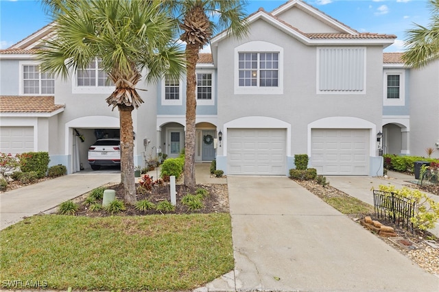 townhome / multi-family property featuring a garage