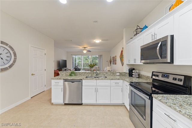 kitchen featuring white cabinetry, stainless steel appliances, and sink