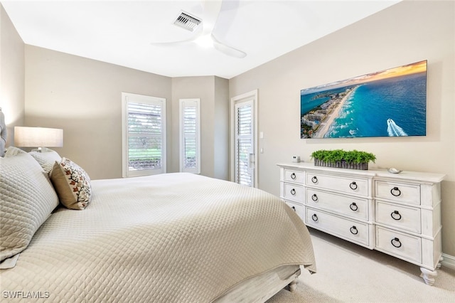 bedroom featuring ceiling fan and light carpet