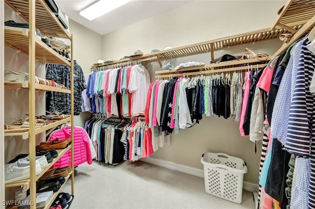 walk in closet featuring carpet floors