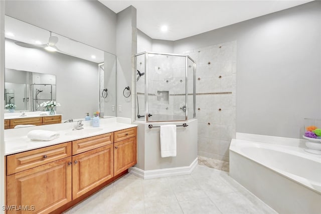 bathroom featuring independent shower and bath, tile patterned floors, and vanity