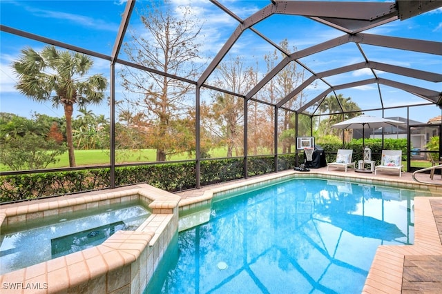 view of pool with glass enclosure and an in ground hot tub