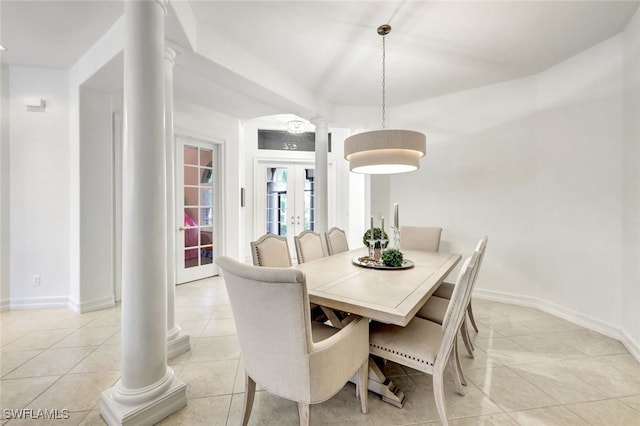 dining area featuring french doors, light tile patterned floors, and ornate columns