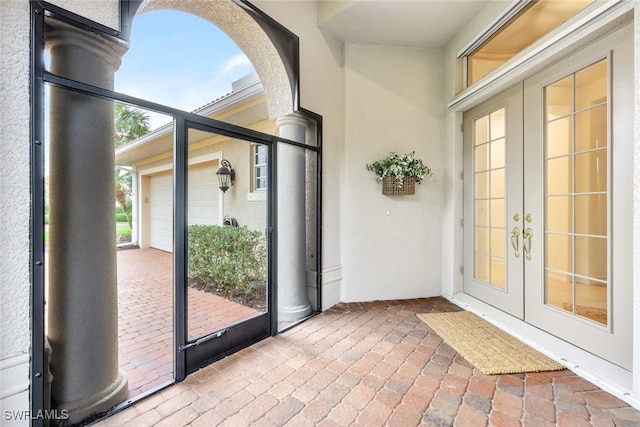 unfurnished sunroom featuring french doors