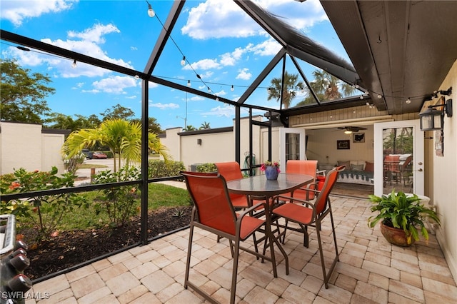 view of patio / terrace with a lanai and ceiling fan