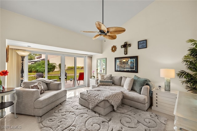 tiled living room featuring ceiling fan and high vaulted ceiling