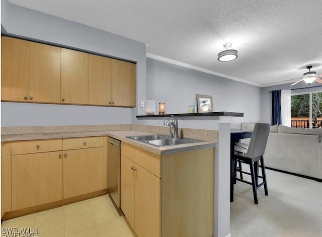 kitchen with a textured ceiling, dishwasher, kitchen peninsula, and sink