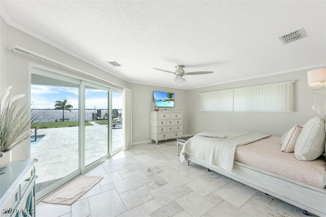 bedroom featuring ceiling fan, crown molding, access to outside, and a textured ceiling