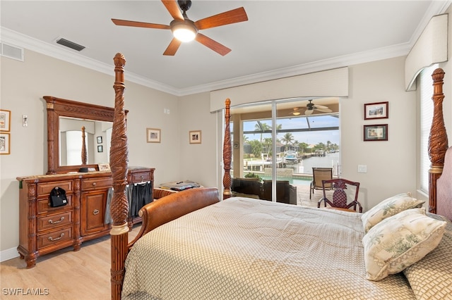 bedroom featuring crown molding, a water view, light hardwood / wood-style flooring, access to outside, and ceiling fan