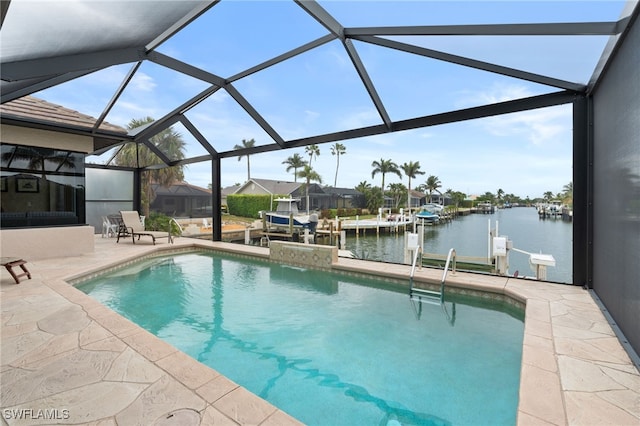 view of pool featuring glass enclosure, a dock, a water view, and a patio