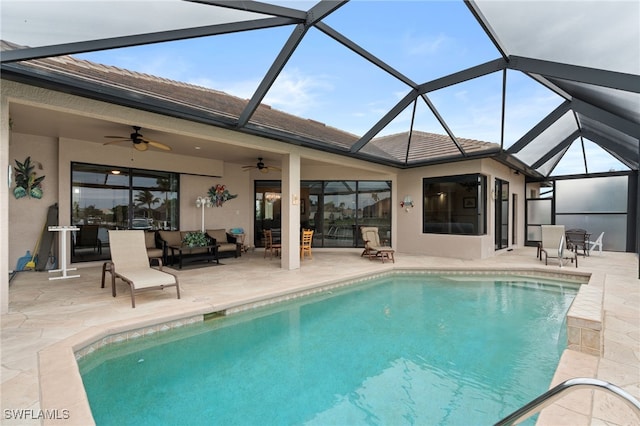 view of swimming pool with a lanai, a patio, and ceiling fan