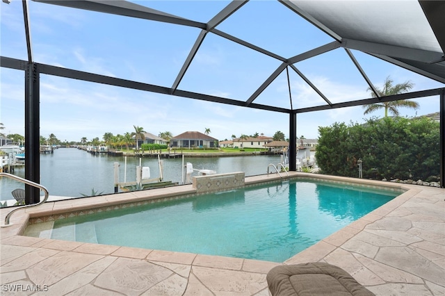 view of pool featuring glass enclosure, a patio area, a water view, and a boat dock