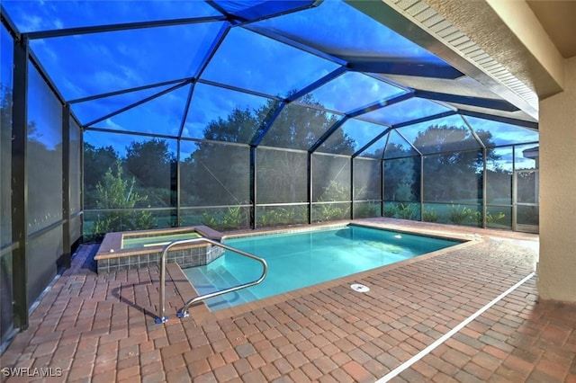 view of swimming pool with a patio, an in ground hot tub, and glass enclosure