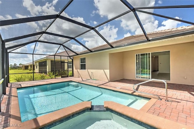 view of swimming pool with a patio, glass enclosure, and an in ground hot tub