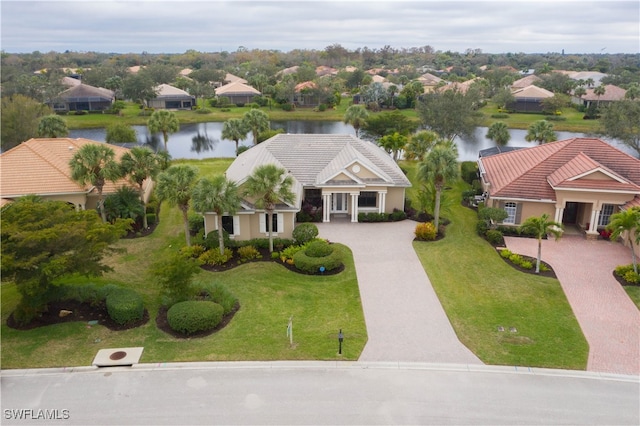 birds eye view of property with a water view