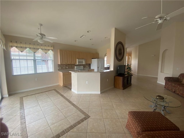 3054 Driftwood Way Unit 4508, Naples, FL 34109 - kitchen featuring white appliances, ceiling fan, open floor plan, light tile patterned floors, and lofted ceiling