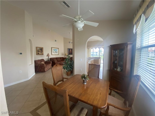 3054 Driftwood Way Unit 4508, Naples, FL 34109 - dining area featuring arched walkways, ceiling fan, light tile patterned floors, and lofted ceiling
